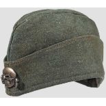 A garrison cap for enlisted men of the Waffen SS Field-grey wool with dark tan satin lining, stamped