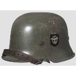 A lightweight steel helmet M 34, police, DD 75 % smooth apple-green paint, 85 % decals, medium brown