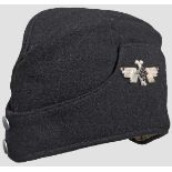 A garrison cap for foreign Hitler Youth Black wool body, two pebbled button front, applied silver