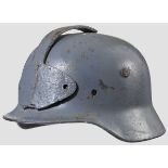 A steel helmet M 40 90 % blue-grey paint, modified with attachment of steel T-shaped device to