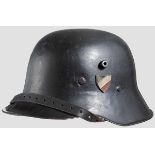 A lightweight steel helmet M 16, reissued 90 % black paint, metal tricolour shield on left,