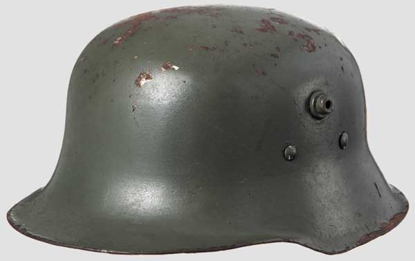 A lightweight steel child's helmet Field-grey painted body with damage and surface rust, brown