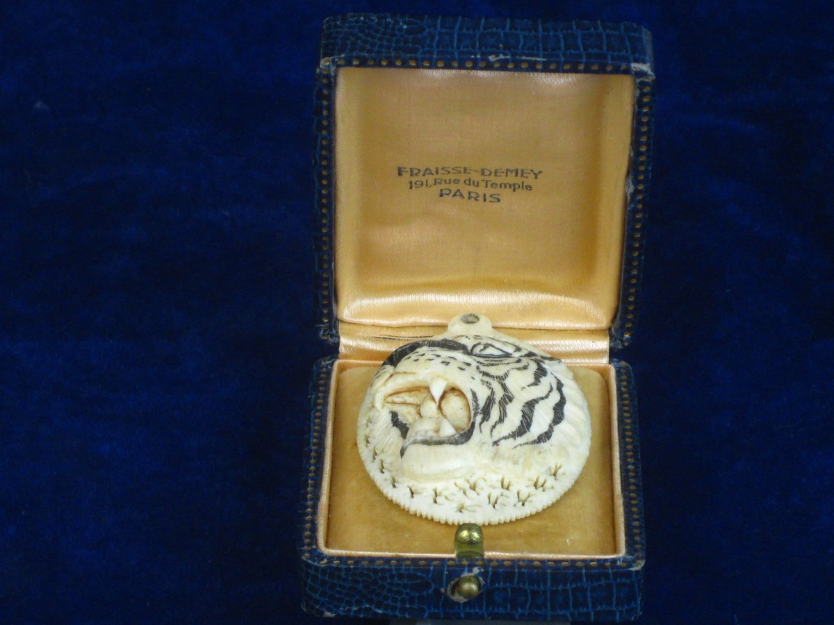 IVORY TIGER PENDANT C19th.   A fine quality ladies pendant made from ivory depicting a roaring tiger