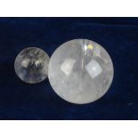 POLISHED QUARTZ SPHERES.  A pair of polished quartz spheres; the larger with a diameter of @ 2 ¼