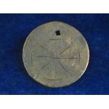 PILGRIM’S PENDANT OR TOKEN.  A circular bronze disc with simple incised decoration of a cross on one