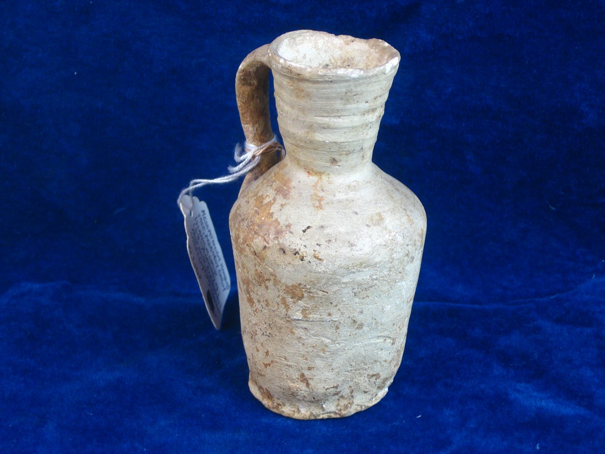 MESOPOTAMIAN JUG 1939 SOTHEBYS LABEL.   Measuring 4 ½ inches tall a simple jug believed to be of