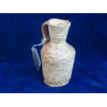 MESOPOTAMIAN JUG 1939 SOTHEBYS LABEL.   Measuring 4 ½ inches tall a simple jug believed to be of