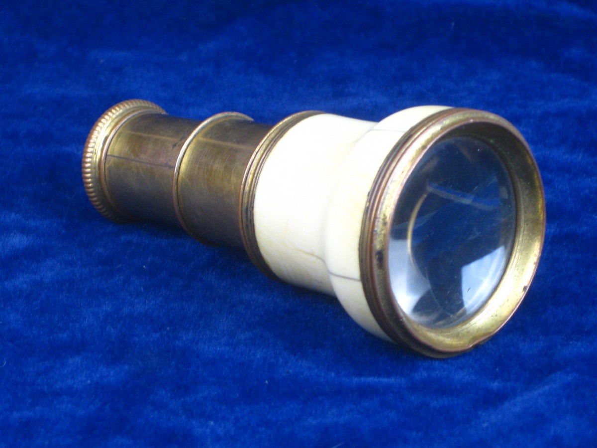 FRENCH IVORY MOUNTED MINIATURE TELESCOPE. In gilded metal and ivory mounts, this miniature telescope