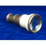 FRENCH IVORY MOUNTED MINIATURE TELESCOPE. In gilded metal and ivory mounts, this miniature telescope