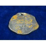SILVER PIECE OF 8 COIN PENDANT.  A wreck-recovered Spanish piece of 8 coin in uncleaned condition