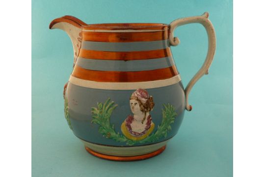 Queen Caroline: an interesting copper lustre banded blue ground pearlware jug moulded with two - Image 1 of 3