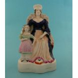 A Staffordshire pottery figure depicting a seated lady, possibly Victoria, with attendant child,