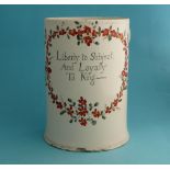 An attractive creamware tankard set with interlaced handles, terminating in moulded flower heads and