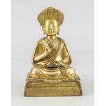 Sitzender Lama-Buddha, Asien, Bronze vergoldet, auf rechteckigem Sockel, fein