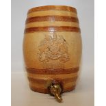 STONEWARE RUM FLAGON WITH BRASS TAP BEAR