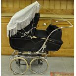 A EARLY PEDIGREE COACHWORK PRAM WITH SUN