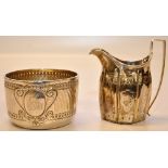 A GEORGE III SILVER CREAM JUG BELIEVED 1