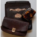 A LEATHER CIGAR CASE AND PURSE WITH YELL