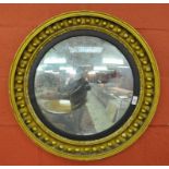 A REGENCY GILT CONVEX CIRCULAR MIRROR 65