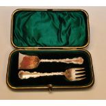 A CASED SILVER PUSHER AND FORK CHRISTENI