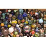 A QUANTITY OF GLASS MARBLES OF ASSORTED