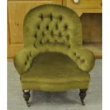 A VICTORIAN BUTTON BACK LOW ARMCHAIR WIT