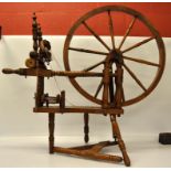 AN OAK SPINDLE TURNED TREADLE SPINNING W