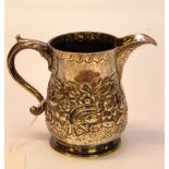 A SILVER MILK JUG CHASED WITH SCROLLS AN