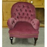 AN EDWARDIAN BUTTON BACK ARMCHAIR WITH P