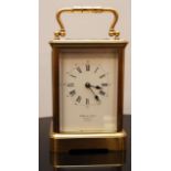 A BRASS CARRIAGE CLOCK STRIKING ON A GONG RETAILED BY HOWELL AND JAMES, REGENT STREET, LONDON,