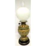 A DOULTON OIL LAMP ON CIRCULAR BASE WITH