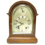 AN EDWARDIAN MAHOGANY MANTLE CLOCK WITH