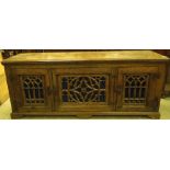 A REPRODUCTION OAK LOW FOOD CUPBOARD IN