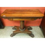 A REGENCY ROSEWOOD GAMES TABLE WITH SUBS