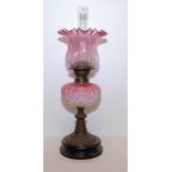 A VICTORIAN PINK GLASS OIL LAMP WITH BRA