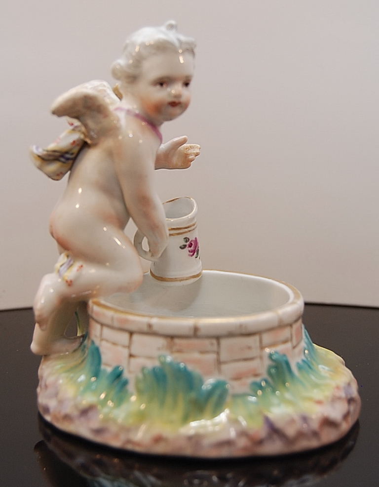 19TH CENTURY BERLIN CHERUB AT A WELL DIS