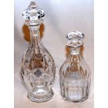 A 20TH CENTURY CUT GLASS DECANTER ALONG