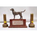 A CAST METAL LABRADOR DOG ON A PLINTH WI