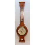 A WALNUT WHEEL BAROMETER BY PHILLIPS AND