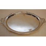 A SILVER TRAY OF TEN SIDED OVAL FORM, CA