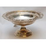 A SILVER CIRCULAR RAISED BOWL, A FRETTED