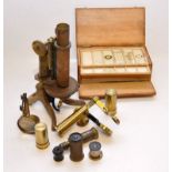 VINTAGE BRASS MICROSCOPE TOGETHER WITH A CASED SET OF SLIDES