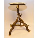 AN UNUSUAL BRASS TABLE, THE BASE CONSTRUCTED FROM 7 ANIMAL HORNS BELIEVED AFRICAN,