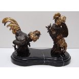 BRONZE AND GILT FIGHTING COCKS