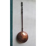 A 19th century copper warming pan, with turned wood handle