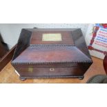 A Victorian rosewood sewing box and contents, the brass presentation plaque to lid dated 1842