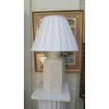 A contemporary French octagonal white ceramic table lamp with pleated shade