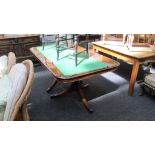 A reproduction twin pillar mahogany extending dining table