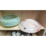 A circa 1930s mottled green glass ceiling light shade, and a scallop moulded soapstone shade