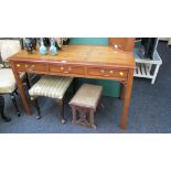 A yew veneered side table, with three frieze drawers on inner chamfered square supports